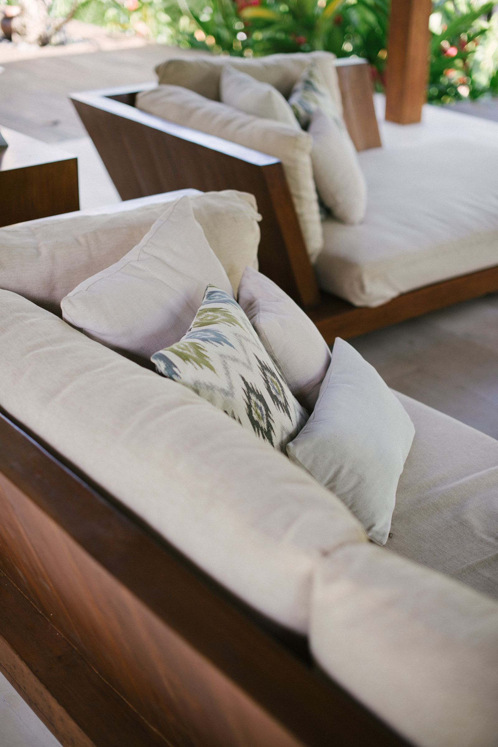 Teak-framed outdoor sofa