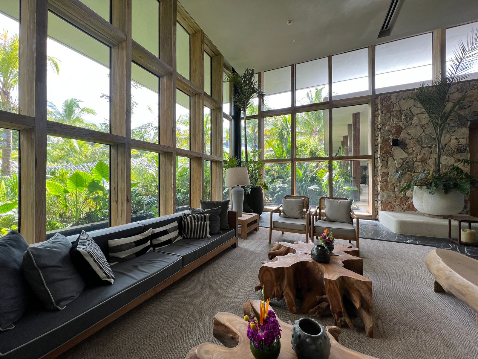 Finished condo living room with floor-to-ceiling windows and a built-in sofa