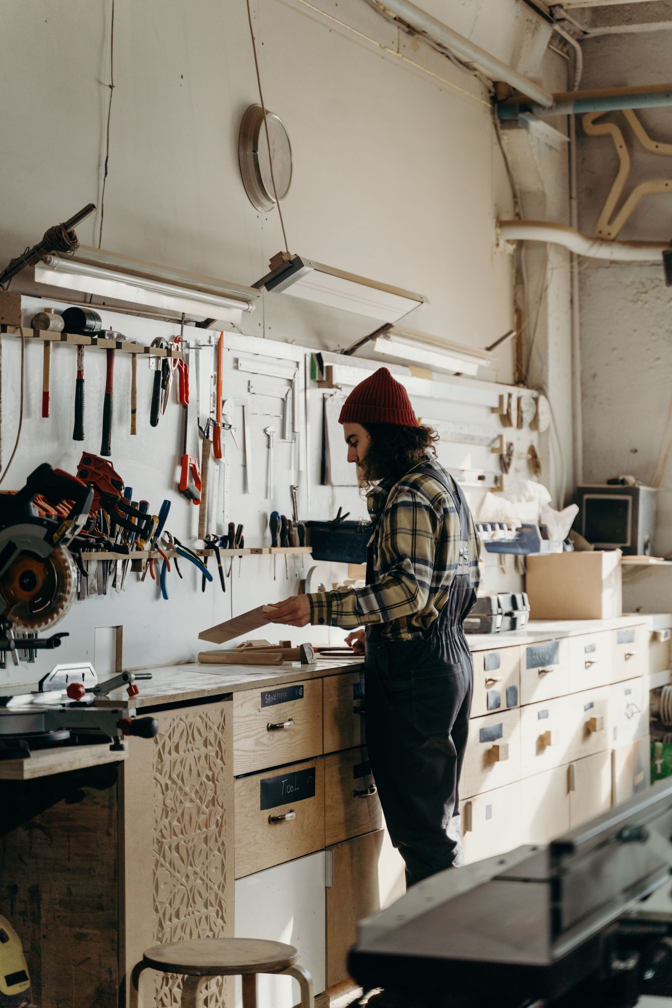 Maker at a workbench in a furniture workshop