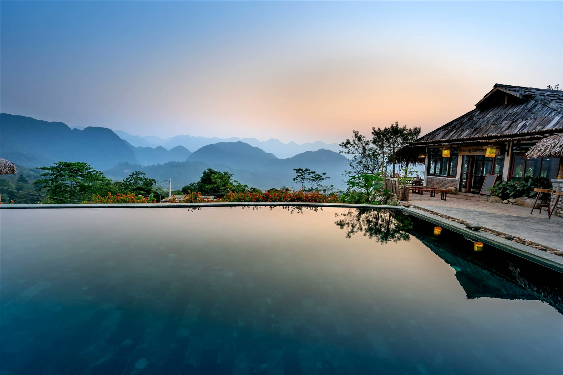 Villa pool and garden at dusk